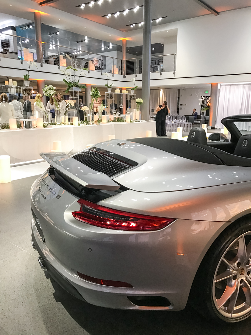 Illustration for article titled This Couple Topped Your Wildest Dreams By Getting Married In A Porsche Showroom
